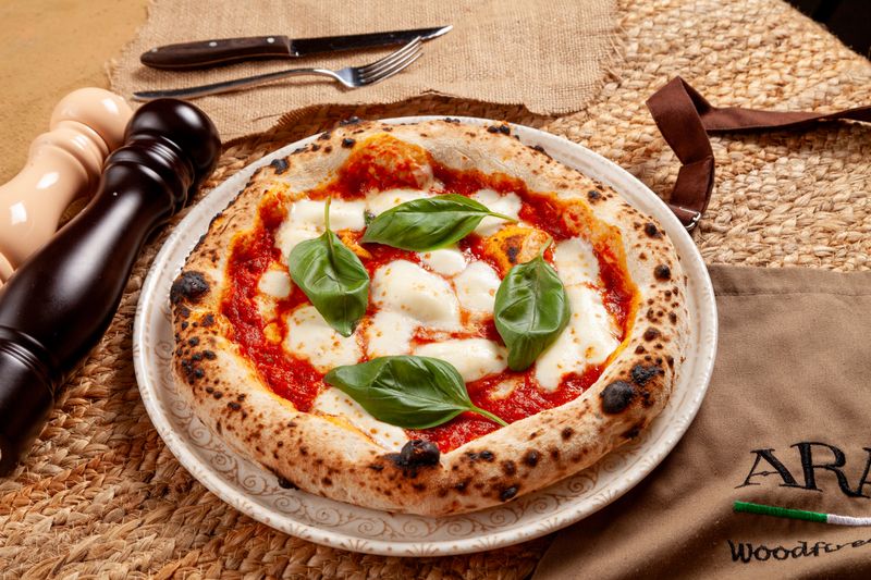 Classic Margherita pizza with fresh basil and mozzarella