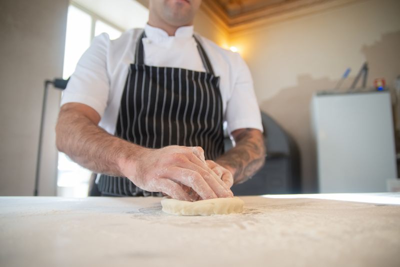 Pizza factory kitchen team working together
